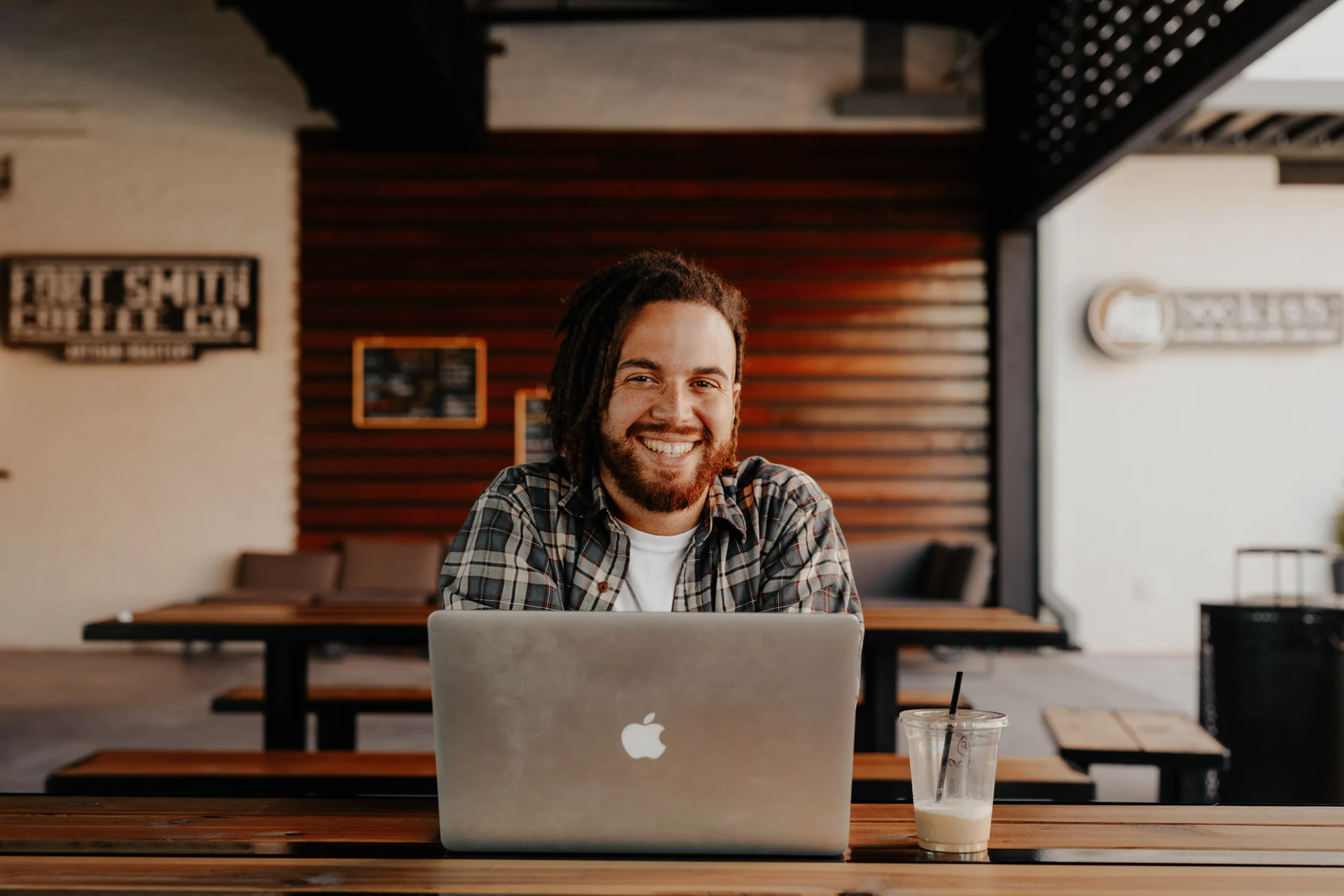 employee at coffee shop laptop